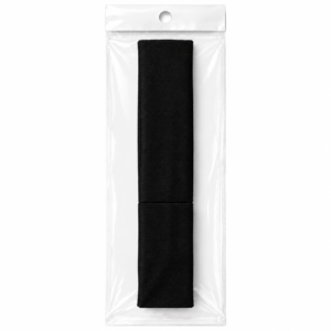 Black fabric hair band in clear plastic packaging on white background