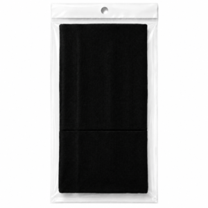 Black fabric hair accessory folded inside clear plastic packaging on white background