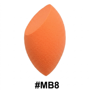 A clear plastic box contains a light-beige teardrop makeup sponge. The box has a gold and black band with the word 'Puff' printed on it. Above the box is a white card with the words 'Packing Sample' on it.