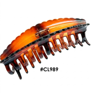 A centered, high-resolution product photograph of an arched, oversized hair claw clip made from translucent tortoiseshell-patterned acrylic, isolated on a pure white background