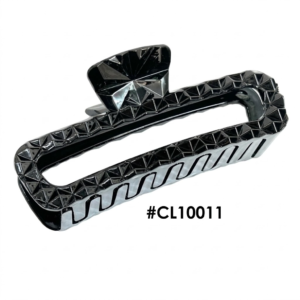 A centered, high-resolution product photograph of a large, glossy black hair claw clip displayed on a pure white background