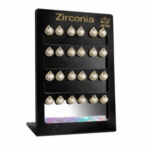 Heart shaped earrings with zirconia stones displayed on a stand