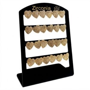 Heart shaped stud earrings in gold with zirconia detailing displayed on a stand