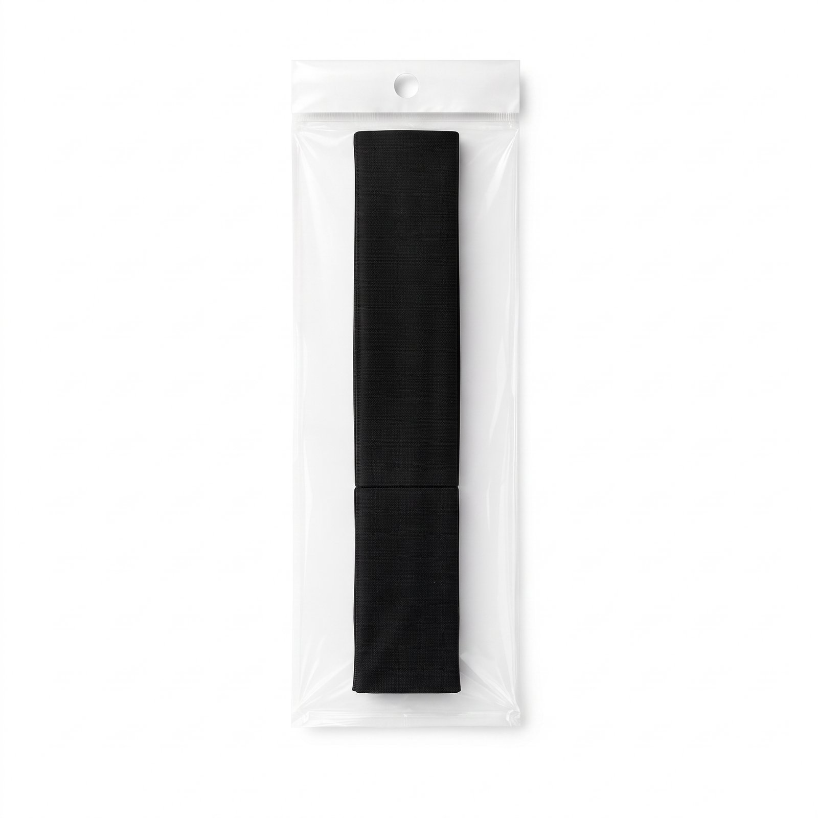 Small black cotton headband in packaging