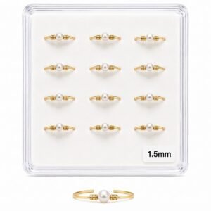 Elegant gold nose studs with pearl accents in a display pack