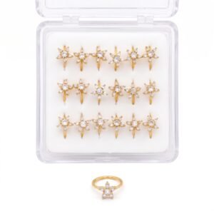 Gold starfish shaped nose rings displayed in a pack