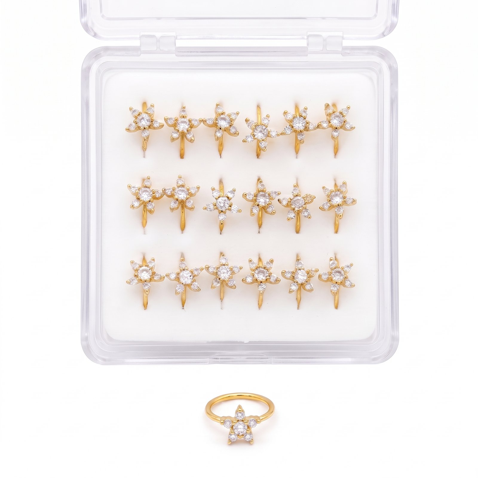 Gold starfish shaped nose rings displayed in a pack